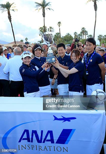 The victorious Japan Team celebrate with the trophy Ayako Uehara, Shiho Oyama, Ayumi Kaihori, and Yayoi Kobayashi during the ANA Footgolf Faceoff...