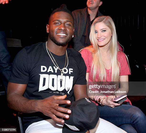 Player Antonio Brown and YouTube influencer Justine Ezarik attend as athletes and YouTube stars team for DOOM Videogame Tournament at Siren Studios...