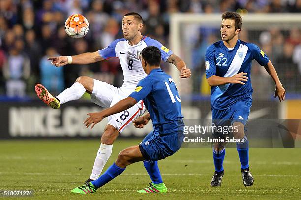 Clint Dempsey of the United States Men's National Team takes control of the ball in the second half in front of Carlos Castrillo and Rodrigo Saravia...