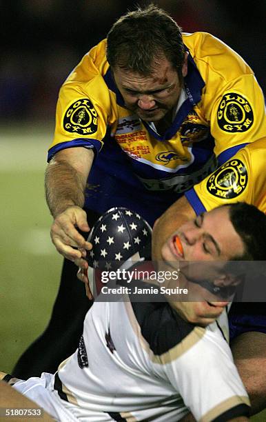 Wayne Hack of the Coogee Dolphins tackles Gareth Baxendale of the Glen Mills Bulls during the first match of the Liberty Bell Cup at Franklin Field...