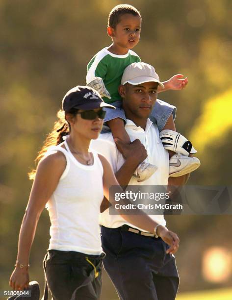 Wallabies captain George Gregan walks up the 13th hole with son Max and wife Erica during the 2004 Australian PGA Championship Pro-Am held at the...