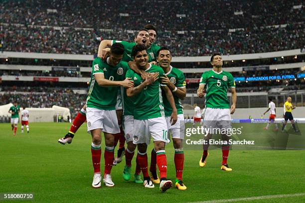 Jesus Corona of Mexico celebrates with teammates after scoring the second goal of his team during the match between Mexico and Canada as part of the...