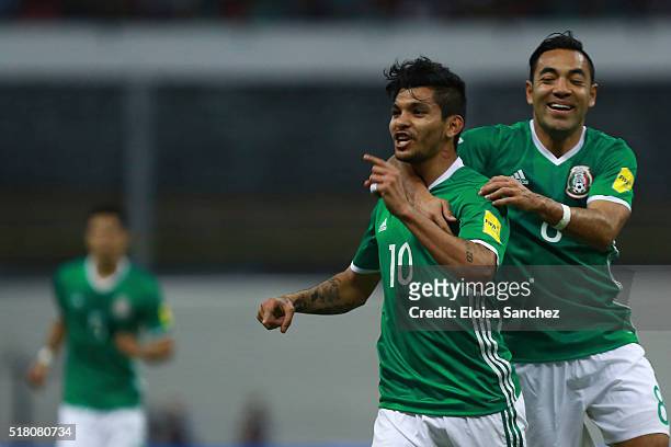 Jesus Corona of Mexico celebrates with teammate Marco Fabian de la Mora after scoring the second goal of his team during the match between Mexico and...