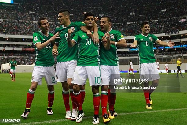 Jesus Corona of Mexico celebrates with teammates after scoring the second goal of his team during the match between Mexico and Canada as part of the...