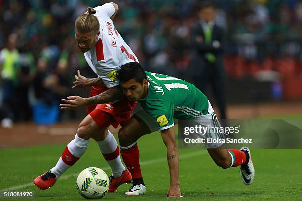 Jesus Corona of Mexico > fights for the ball with Marcel De Jong of Canada during the match between Mexico and Canada as part of the FIFA 2018 World...