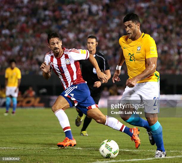 Hulk of Brazil and Jonathan Santana of Paraguay fight for the ball during a match between Paraguay and Brazil as part of FIFA 2018 World Cup...