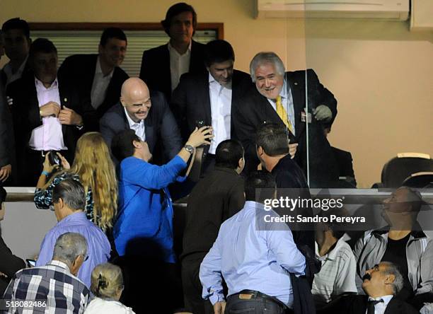 Gianni Infantino President of FIFA poses with a fan during a match between Uruguay and Peru as part of FIFA 2018 World Cup Qualifiers at Centenario...