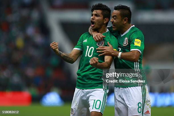 Jesus Corona of Mexico celebrates with teammate Marco Fabian de la Mora after scoring the second goal of his team during the match between Mexico and...