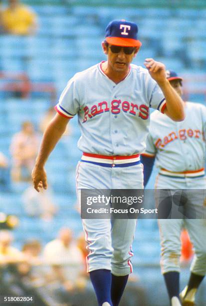 Manager Billy Martin of the Texas Rangers walks back to the dugout after arguing with an umpire during a Major League Baseball game against the...