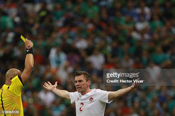 Nikolas Ledgerwood of Canada compalins to referee Yadel Martinez during the match between Mexico and Canada as part of the FIFA 2018 World Cup...