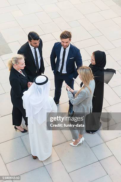 business team in middle east - dubai people interacting stock pictures, royalty-free photos & images