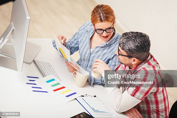 Discuss Files Business Colleagues Analyzing Files And Discussing In The Office High ...