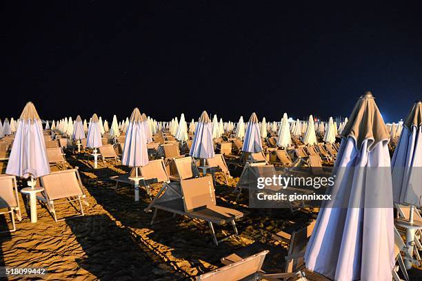 summer night on the beach in cattolica, emilia romagna, italy - cattolica beach stock pictures, royalty-free photos & images
