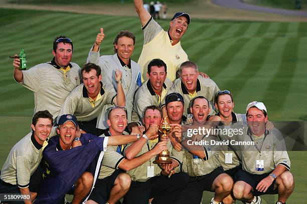 The European caddies celebrate victory with Bernhard Langer during the Closing Ceremonies at the 35th Ryder Cup Matches at the Oakland Hills Country...