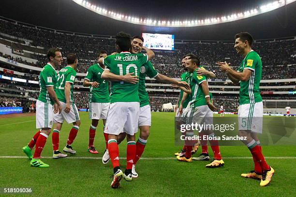 Jesus Corona of Mexico celebrates with teammates after scoring the second goal of his team during the match between Mexico and Canada as part of the...