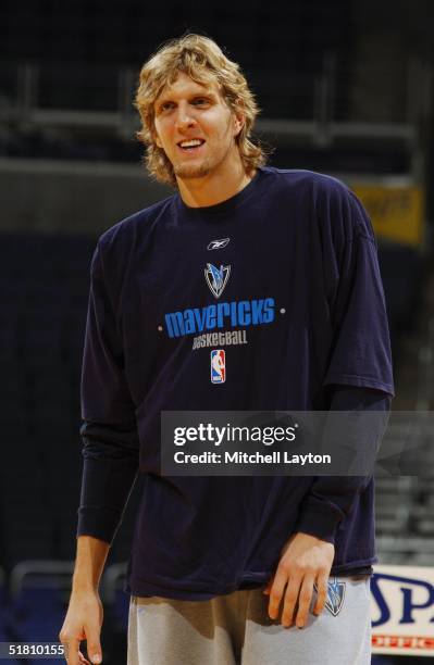 Dirk Nowitzki of the Dallas Mavericks looks on before facing the Washington Wizards November 14, 2004 at the MCI Center in Washington DC. The...