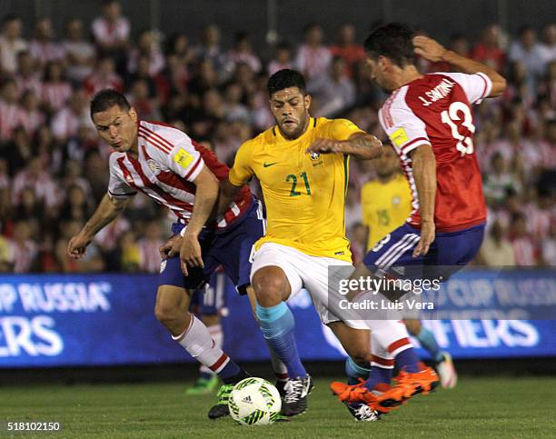 Hulk of Brazil Pablo Aguilar and Jonathan Santana of Paraguay fight for the ball during a match between Paraguay and Brazil as part of FIFA 2018...