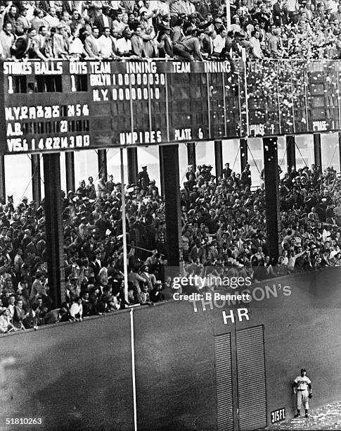 Jubilant New York baseball Giants fans toss confetti and throw their arms in the air like they just don't care after Scottish-born American...