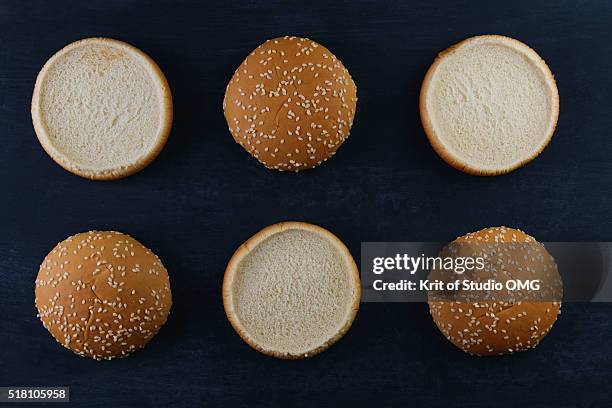 burger bun sesame seeds - sesame seed bun stock pictures, royalty-free photos & images