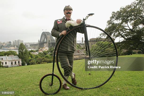 Lloyd Scott poses in front of the Harbour Bridge with his Penny Farthing bicycle during the final day of a cycling trip from Perth to Sydney December...