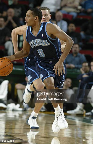 Howard Eisley of the Utah Jazz dribbles against the Seattle SuperSonics December 1, 2004 at Key Arena in Seattle, Washington. NOTE TO USER: User...