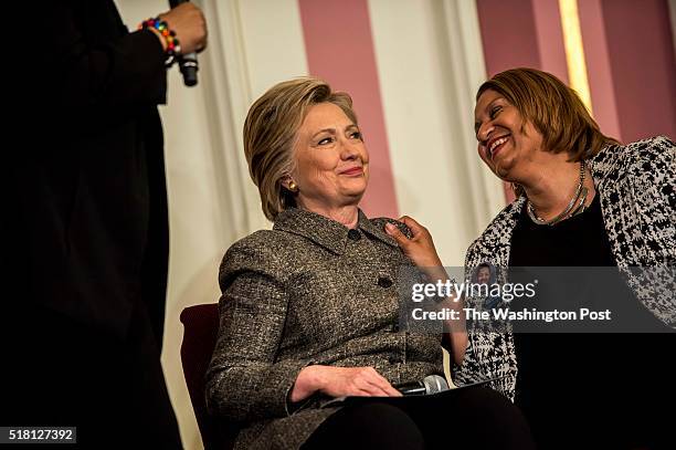 Former Secretary of State Hillary Clinton conducts a forum on preventing gun violence, with advocate Annette Holt, right, mother of Blair Holt who...