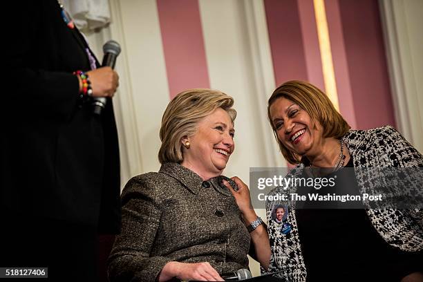 Former Secretary of State Hillary Clinton conducts a forum on preventing gun violence, with advocate Annette Holt, right, mother of Blair Holt who...