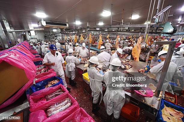 Employees cut beef portions in the boning room at a Bindaree Beef Ltd. Facility in Inverell, Australia, on Thursday, March 24, 2016. With funds from...