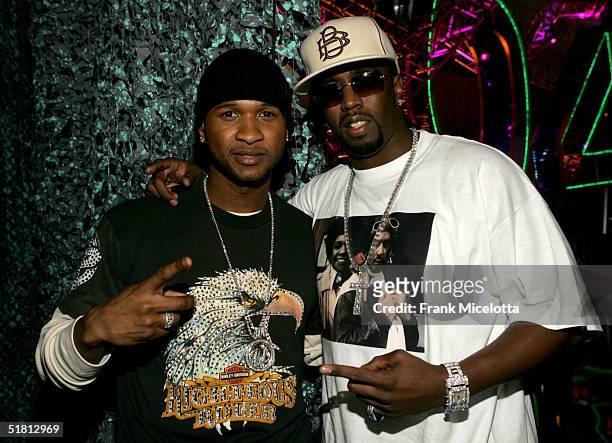 Singer Usher and rapper/producer Sean "P. Diddy" Combs pose backstage during the VH1 Big in 04 at the Shrine Auditorium on December 1, 2004 in Los...