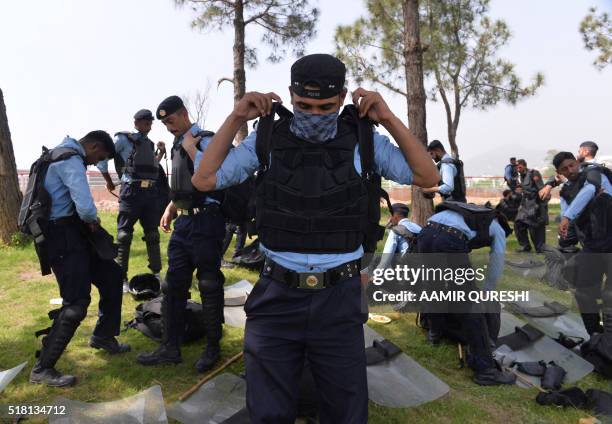 Pakistani security personnel prepare to clear the area where supporters of convicted murderer Mumtaz Qadri are gathered during an anti-government...