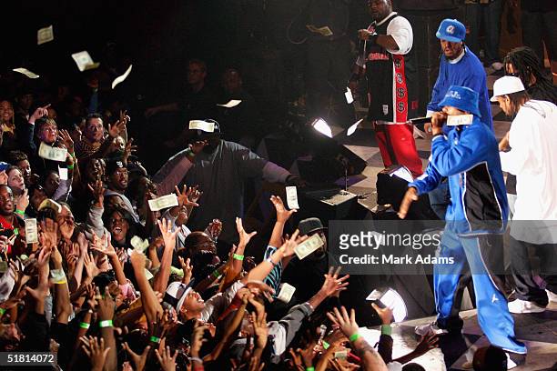 Rapper Roy Jones, Jr. Throws money at the crowd at The Tabernacle during the Lil' John & The East Side Boyz MTV2 $2 Bill Concert on December 1, 2004...