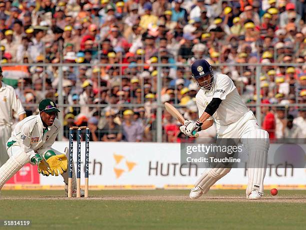 Sachin Tendulkar of India hits out during day 5 of the second test between India and South Africa at Eden Gardens on December 2, 2004 in Calcutta,...