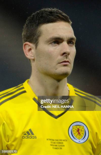 Scotland's goalkeeper Craig Gordon stands during the national anthems at the start of the international friendly football match between Scotland and...
