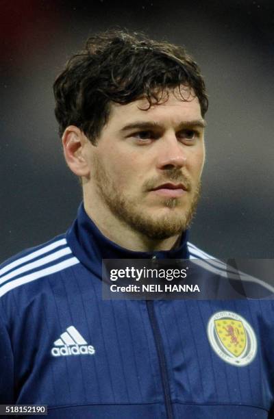 Scotland's defender Gordon Greer stands during the national anthems at the start of the international friendly football match between Scotland and...