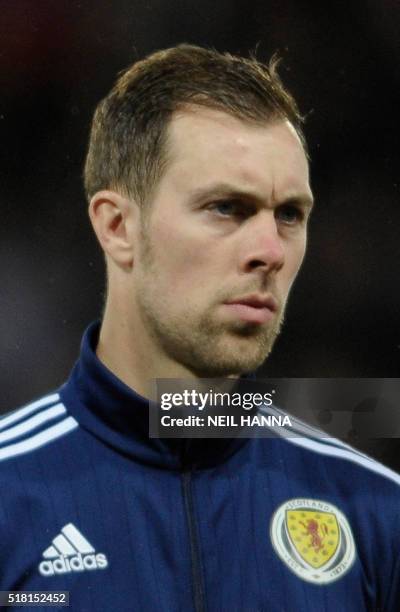 Scotland's defender Steven Whittaker stands during the national anthems at the start of the international friendly football match between Scotland...