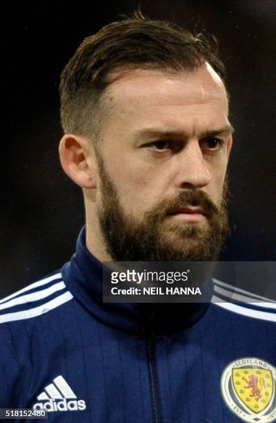 Scotland's striker Steven Fletcher stands during the national anthems at the start of the international friendly football match between Scotland and...