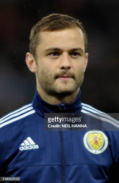 Scotland's midfielder Shaun Maloney stands during the national anthems at the start of the international friendly football match between Scotland and...