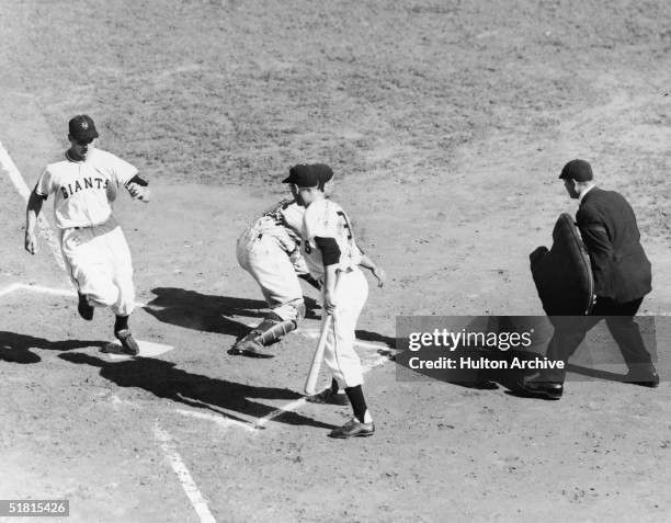 American baseball player Bobbby Thomson of the New York Giants scores a run in the second inning of game three of the World Series, New York, New...