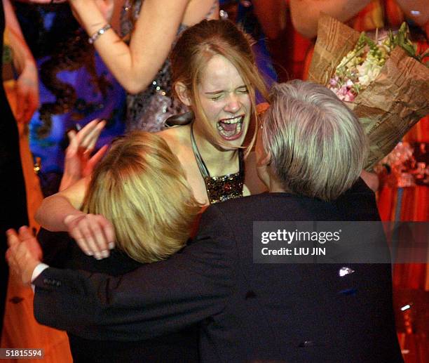 Sofie Oosterwaal from Holland embraces her parents after winning the champion of the OLAY Elite Model Look 2004 International Finals in Shanghai, 02...