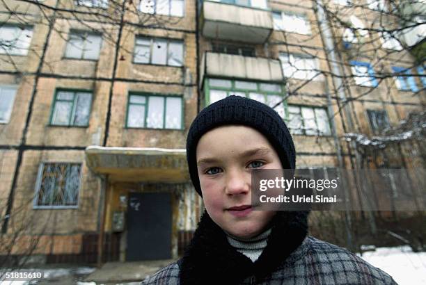 Young Ukrainian boy is seen standing outside his home December 2, 2004 in Donestk, Ukraine. Donetsk is in the Pro-Viktor Yanukovich ethnic Russian...