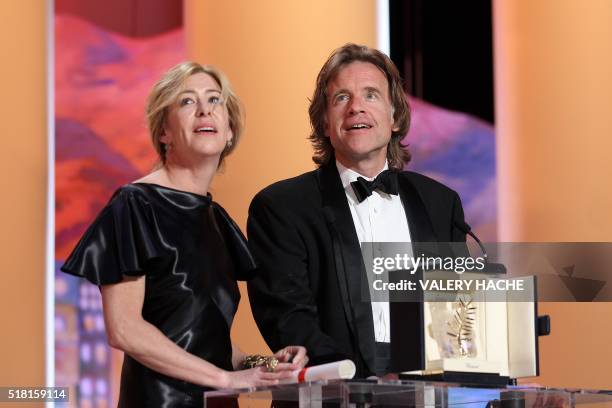 Producers Bill Pohlad and Dede Gardner speak on behalf of US director Terrence Malick after he was awarded with the Palme D'Or for his movie "The...