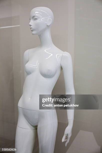 white mannequin beautiful naked woman behind the glass showcases. - no clothes girls stock pictures, royalty-free photos & images