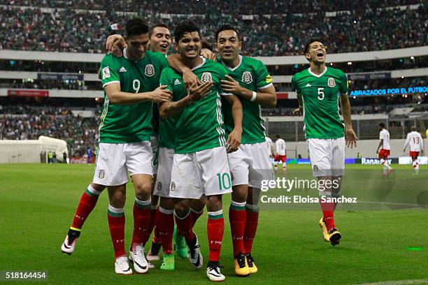 Jesus Corona of Mexico celebrates with teammates after scoring the second goal of his team during the match between Mexico and Canada as part of the...