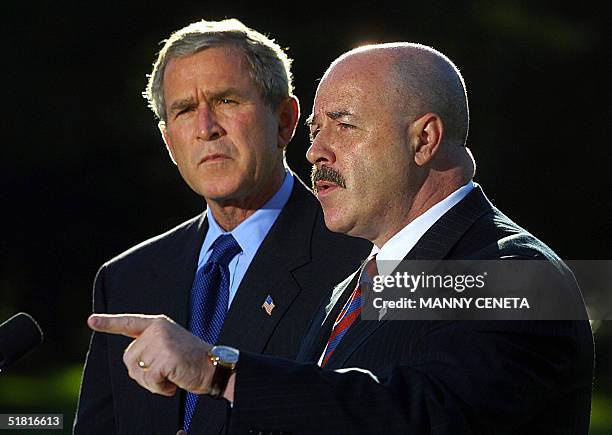 This 03 October file photo shows former New York City Police Commissioner Bernard Kerik , with US President George W. Bush , addressing the media on...