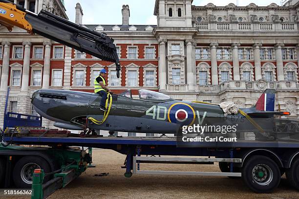 World War 2 Spitfire Mk XVI is unloaded from a truck at Horse Guards Parade on March 30, 2016 in London, England. The RAF Museum will display...