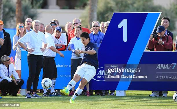 Ayumi Kaihori of the Japan Soccer team kicks a ball watched by Abby Wambach and Julie Foudy of the United States during the ANA Footgolf Faceoff...