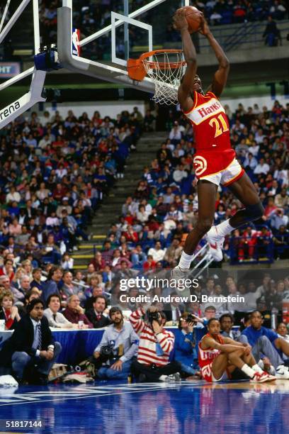 Dominique Wilkins of the Atlanta Hawks goes for a dunk during the Gatorade Slam Dunk Championship during the 1986 NBA All-Star Weekend at Chicago...