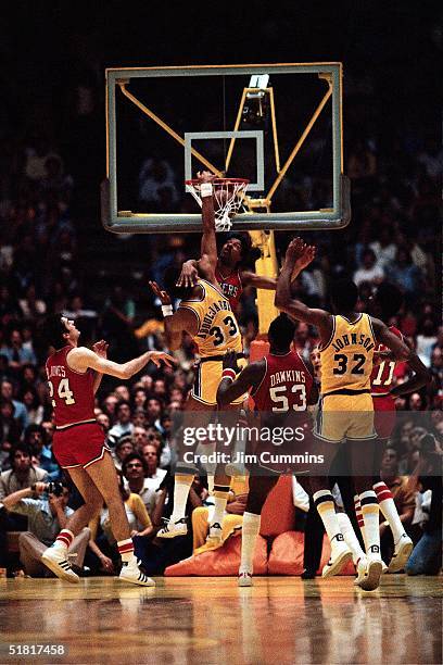 Kareem Abdul-Jabbar of the Los Angeles Lakers dunks on Julius Erving of the Philadelphia 76ers during Game 5 of the NBA Finals on May 14, 1980 in...