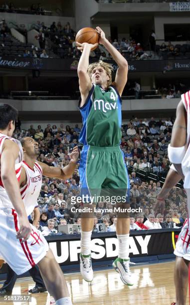 Dirk Nowitzki of the Dallas Mavericks shoots against the Houston Rockets at the American Airlines Center on December 2, 2004 in Dallas, Texas. NOTE...