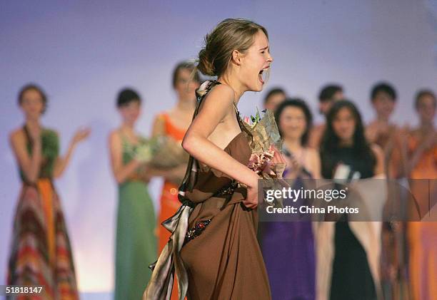 Sofie Oosterwaalal of the Netherlands celebrates after winning the OLAY Elite Model Look 2004 International Finals on December 2, 2004 in Shanghai,...